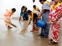 CLEANING THE BATHING GHATS