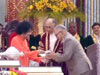 Shri Paramahansa recieving a cheque of Re 60 lakhs from Swami
