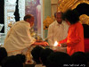 Lighting the arathi to conclude the Akhanda Bhajan