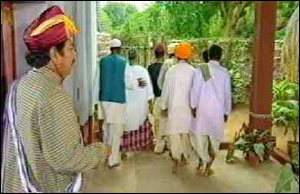 The villagers leave after giving the warning. Mrs. Patel now joins her husband. 