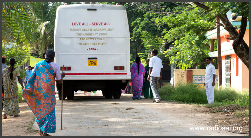 old-indian-woman-walks-to-the-mobile-hospital-bus-landscape